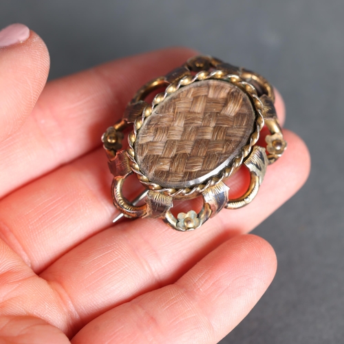 3259 - Curiosity/Macabre: Victorian Mourning Brooch
The woven hair of a deceased loved one under glass in o... 