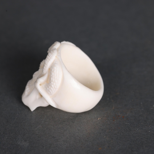 3260 - Curiosity/Macabre: Ring hand carved from water buffalo bone. Intricately detailed and carved in the ... 