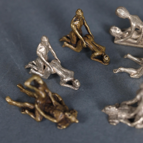 3263 - Curiosity/Macabre : A group of nine small brass and base metal erotic sculptures, (9).