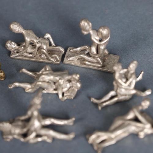 3263 - Curiosity/Macabre : A group of nine small brass and base metal erotic sculptures, (9).