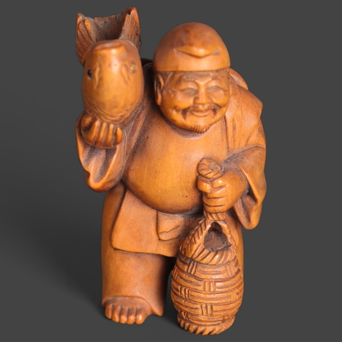 3266 - Netsuke: Boxwood Fisherman
A man carrying a large fish on his shoulder and holding basket. Signed to... 