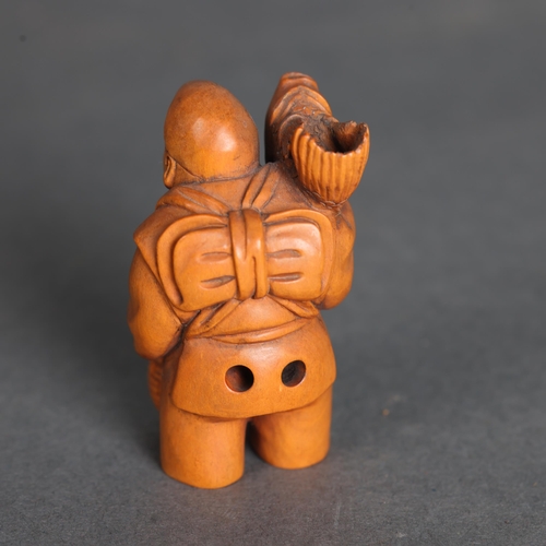 3266 - Netsuke: Boxwood Fisherman
A man carrying a large fish on his shoulder and holding basket. Signed to... 