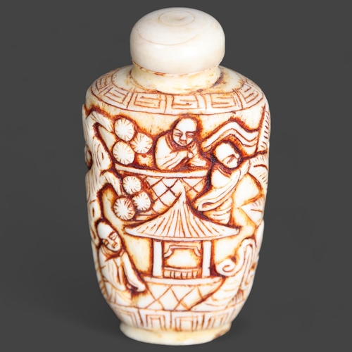 3269 - Chinese Carved Bone snuff bottle. Carved with monks, temples, trees and leaves.