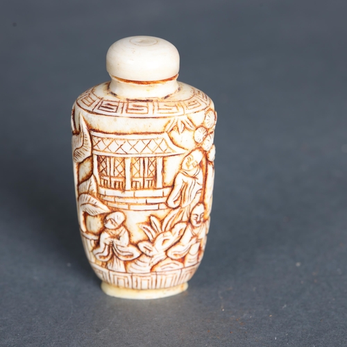 3269 - Chinese Carved Bone snuff bottle. Carved with monks, temples, trees and leaves.