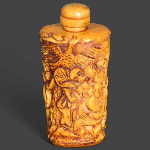 3270 - Chinese Bone Snuff Bottle depicting God of Longevity riding a deer.
The carving in elaborate deep re... 