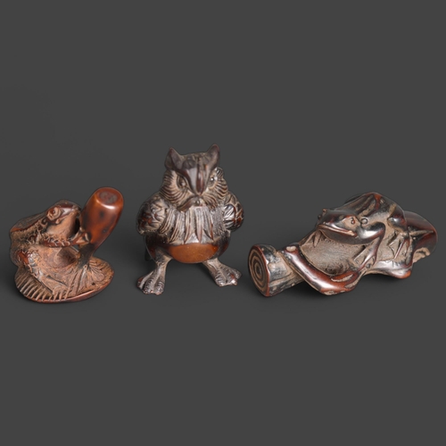 3272 - Netsukes: Owl, Frog, Toad 
A collection of three netsukes. An owl, a frog on a log and a toad on an ... 