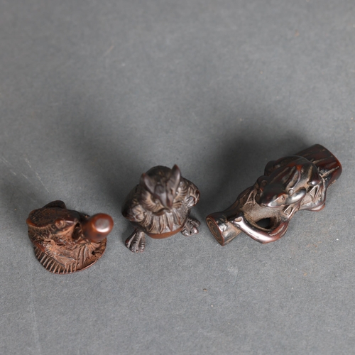 3272 - Netsukes: Owl, Frog, Toad 
A collection of three netsukes. An owl, a frog on a log and a toad on an ... 