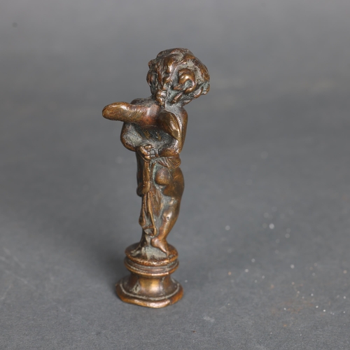 3277 - Bronze Statue of Cupid Bound 
A solid minature bronze of a bound Cupid, often titled “Les Liens De L... 