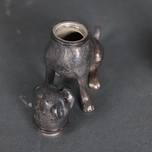 3280 - A vintage spelter nodding dog, smoking a pipe, unsigned, height 6cm, and a silver plated Pug peppere... 