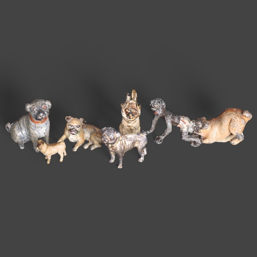 3284 - A group of miniature animals, including a Bergman's coal painted bronze seated Pug and bandaged Pug,... 