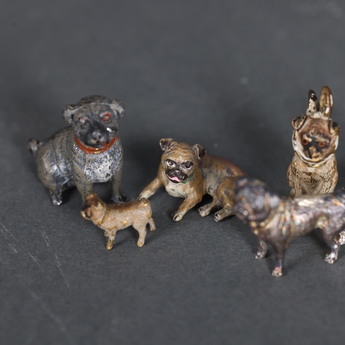 3284 - A group of miniature animals, including a Bergman's coal painted bronze seated Pug and bandaged Pug,... 