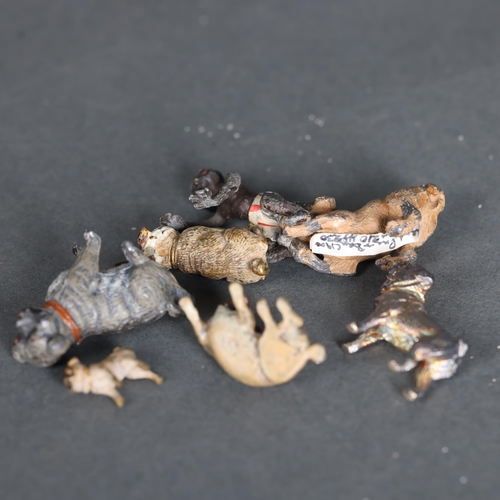 3284 - A group of miniature animals, including a Bergman's coal painted bronze seated Pug and bandaged Pug,... 