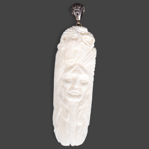 3290 - Jewellery: Pendant, hand carved buffalo bone with silver bail.
Beautifully carved with the head of a... 