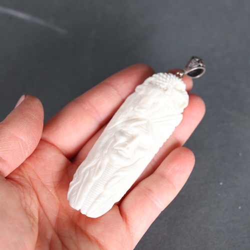 3290 - Jewellery: Pendant, hand carved buffalo bone with silver bail.
Beautifully carved with the head of a... 