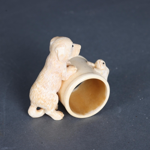 3292 - Curiosity/Macabre: Hand carved bone Napkin ring, with dog and frog detail.