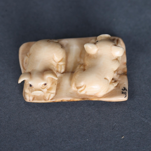 3294 - Netsuke: pair of Pigs, carved from Mammoth tusk ivory. 
Exquisitely carved from this ~15,000 year ol... 