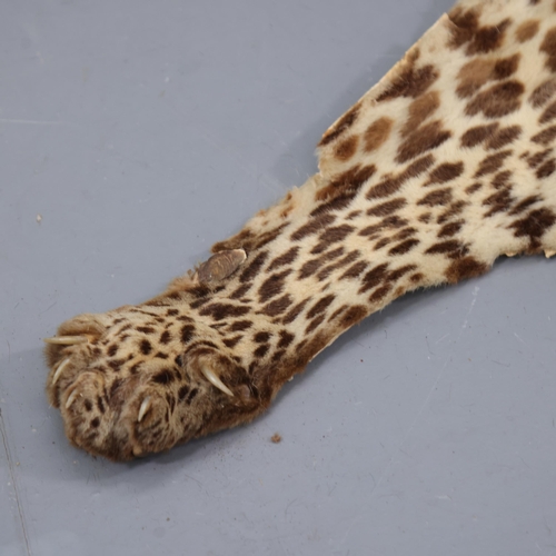 3340 - WITHDRAWN Taxidermy - an antique Indian Leopard skin rug, no taxidermist labels, head to tail 220cm,... 