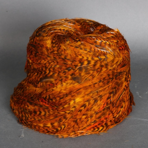 3342 - Lazarus, Paris Cincinnati, a Pheasant feather and wool ladies hat, labelled to inside, in associated... 