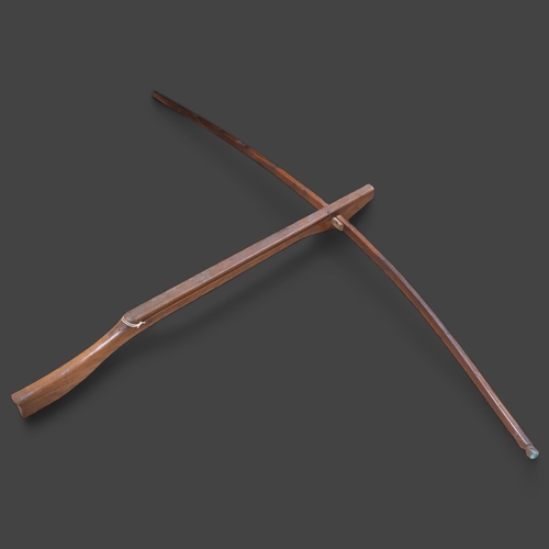 3384 - An Antique apprentice piece wooden crossbow, length 104cm.