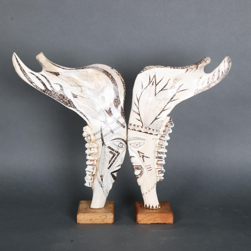 3410 - Natural History : Carved Pair of North American Elk Jaws.
Each jaw still retaining original teeth. T... 