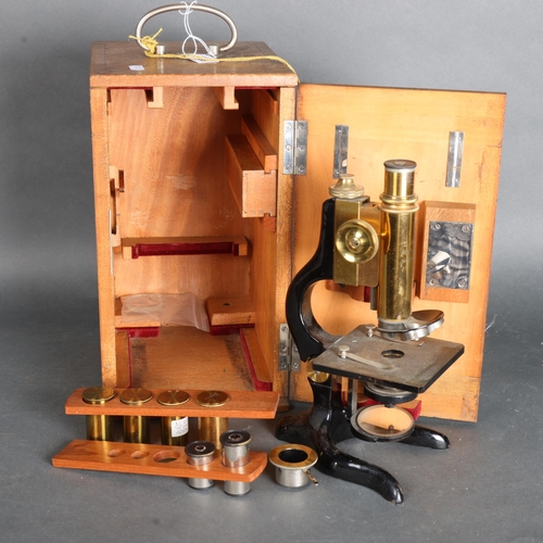 3438 - E. Leitz Wetzlar, an early 20th Century brass and oxidised monocular microscope, number 134099, in o... 