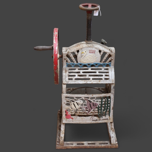 3450 - SWAN - an early 20th Century cast iron ice shaving machine, makers plaque, height 67cm.