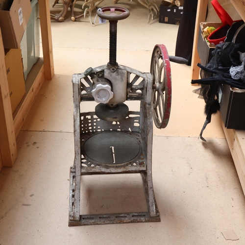 3450 - SWAN - an early 20th Century cast iron ice shaving machine, makers plaque, height 67cm.