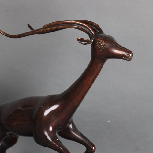 3460 - Natural History : A cast bronze study of a leaping antelope, unsigned, height 43cm.