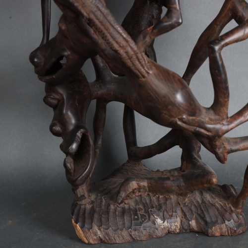 3465 - A large mid-century African Makonde Shetani ironwood sculpture featuring intertwined creatures, heig... 