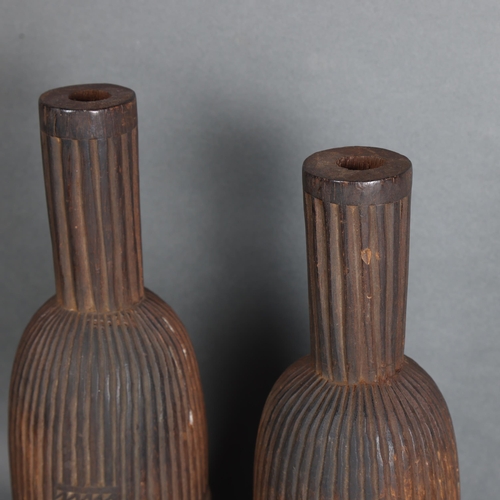 3469 - A pair of African tribal ceremonial carved wood representations of drums, indistinct inscriptions to... 