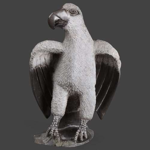 3487 - Natural History : A large carved stone study of an Eagle, unsigned, height 52cm.