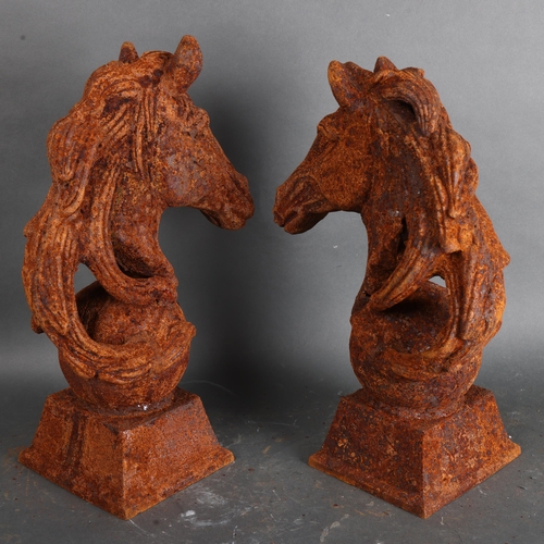 3490 - A pair of cast iron Horse head finials, unsigned, height 45cm, (2).