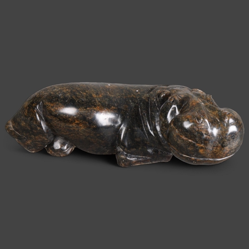 3492 - Natural History : A carved stone sculpture of a hippopotamus, unsigned, length 37cm.