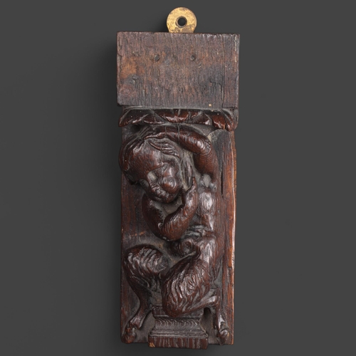 3504 - An 18th Century Oak carving, relief study of a infant Faun, length 20cm.