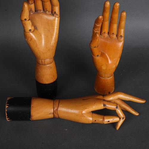 3524 - A group of three similar vintage carved wood articulated artist's hands, largest, height 30cm, (3)