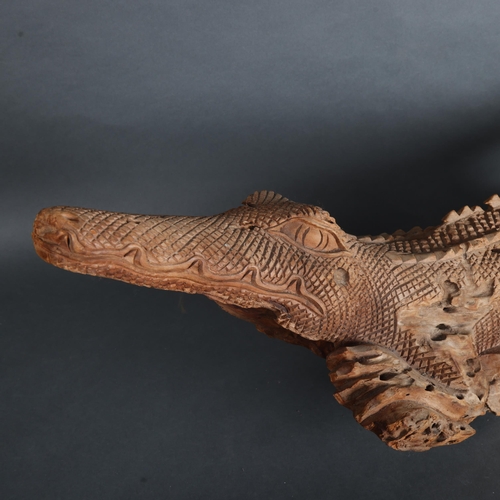 3526 - Natural History : A large carved driftwood sculpture of crocodile, unsigned, length 96cm.