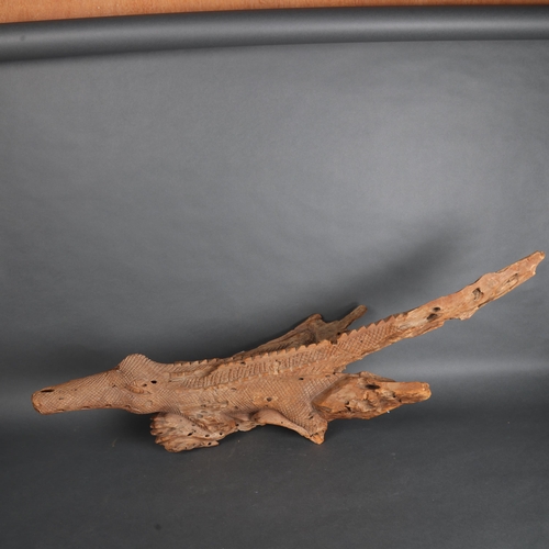 3526 - Natural History : A large carved driftwood sculpture of crocodile, unsigned, length 96cm.