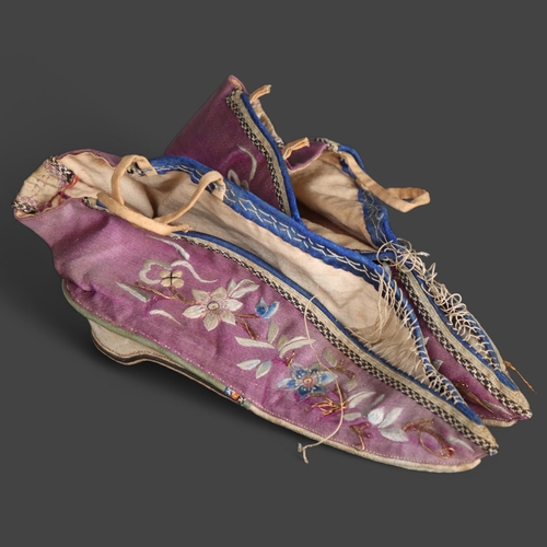 3530 - A pair of Antique Chinese embroidered silk binding shoes.