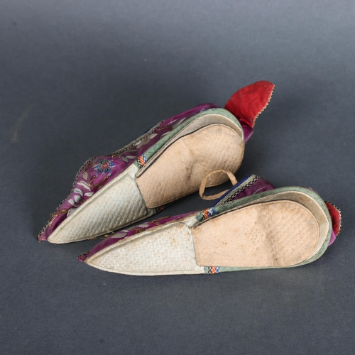 3530 - A pair of Antique Chinese embroidered silk binding shoes.