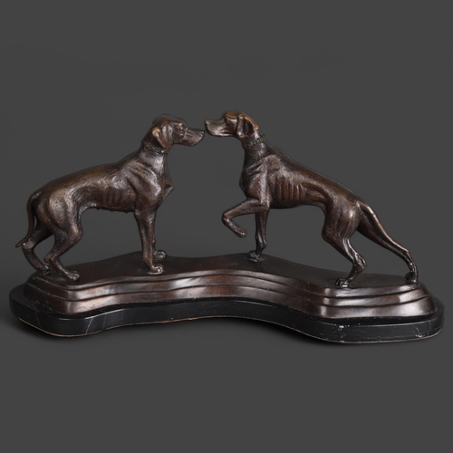 3537 - A cast bronze group, two Hunting dogs on a shaped black marble plinth, unsigned, length 50cm.