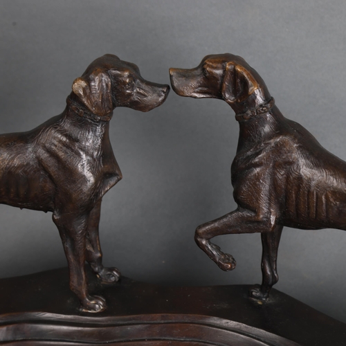 3537 - A cast bronze group, two Hunting dogs on a shaped black marble plinth, unsigned, length 50cm.