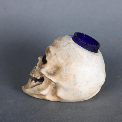 3546 - Curiosity/Macabre: An Antique porcelain ink-well in the form of a skull with glass eyes, height 7cm.