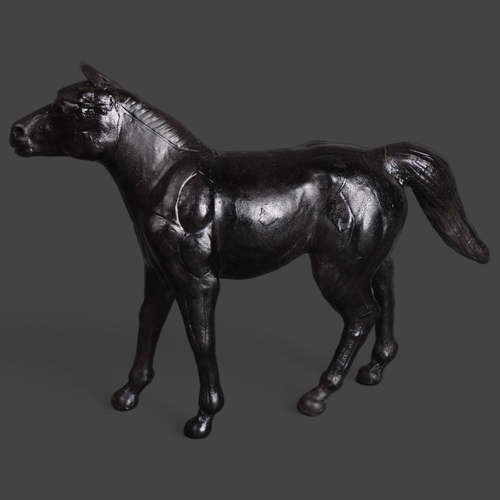 3569 - Liberty Style Black Leather Model of a Horse 
The animal being well modelled with defined features i... 