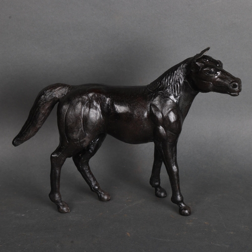 3569 - Liberty Style Black Leather Model of a Horse 
The animal being well modelled with defined features i... 