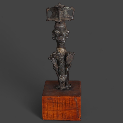 3574 - An African bronze tribal chief on wooden base, unsigned, height 30.5cm.