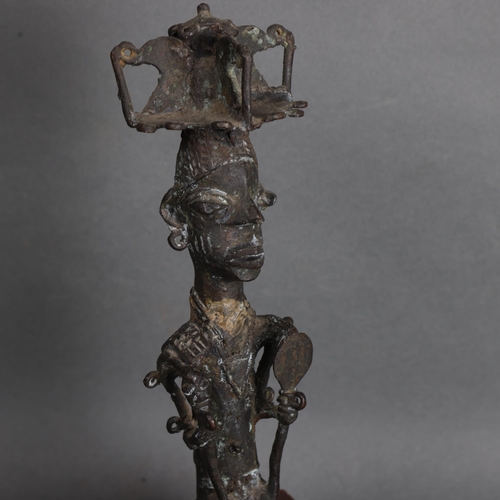 3574 - An African bronze tribal chief on wooden base, unsigned, height 30.5cm.