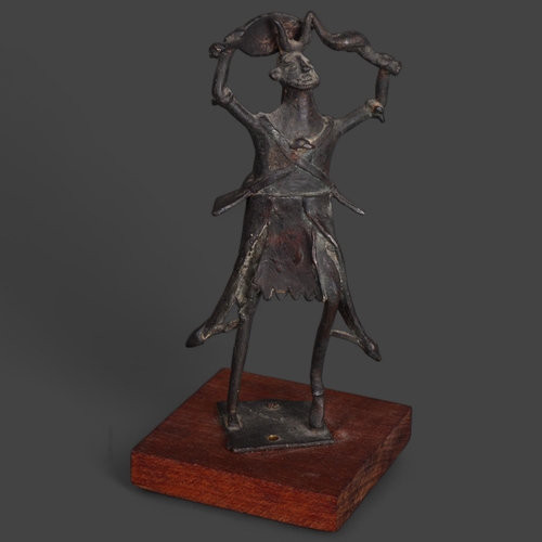 3575 - An African tribal bronze warrior dance figure on wooden base, unsigned, height 22cm.