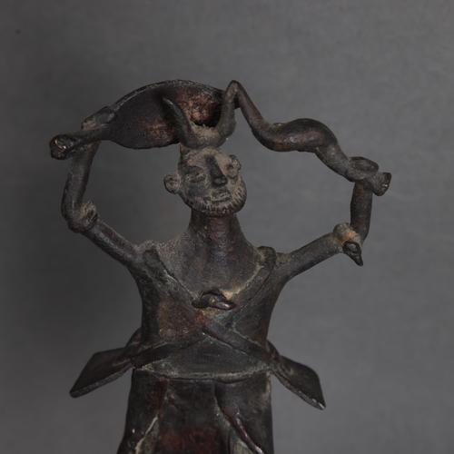 3575 - An African tribal bronze warrior dance figure on wooden base, unsigned, height 22cm.