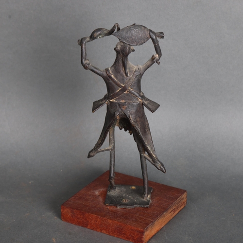 3575 - An African tribal bronze warrior dance figure on wooden base, unsigned, height 22cm.