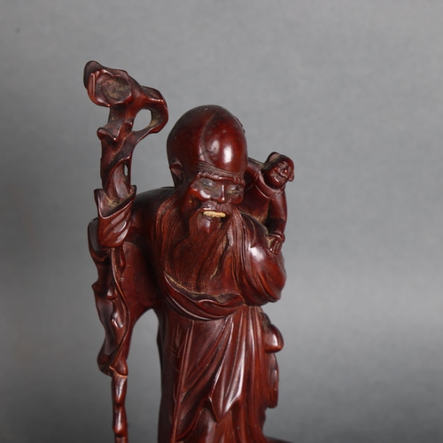 3577 - Chinese Hardwood Carving of The God of Longevity Shoulao, 19th century.
The God holding staff and wi... 